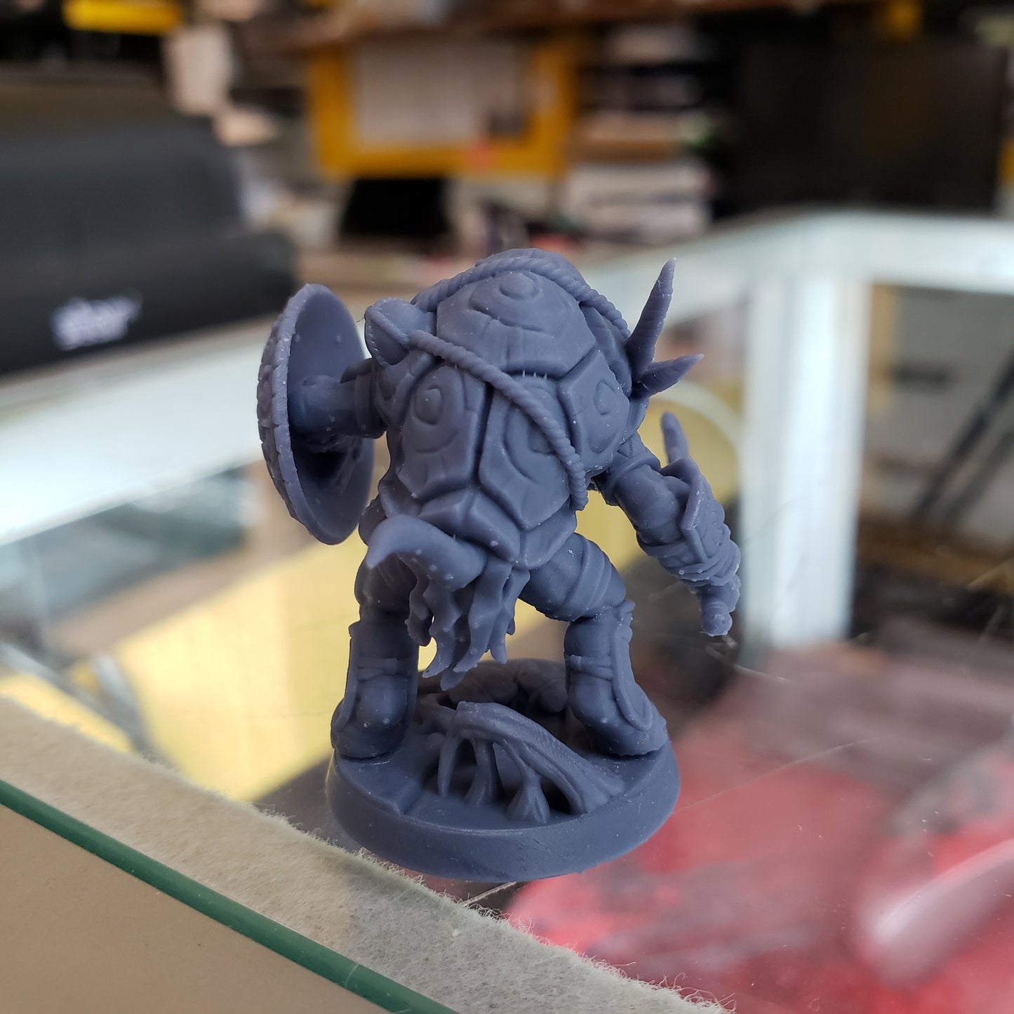 Image shows an example of a 3D printed turtle warrior gaming miniature printed in-house at All Systems Go