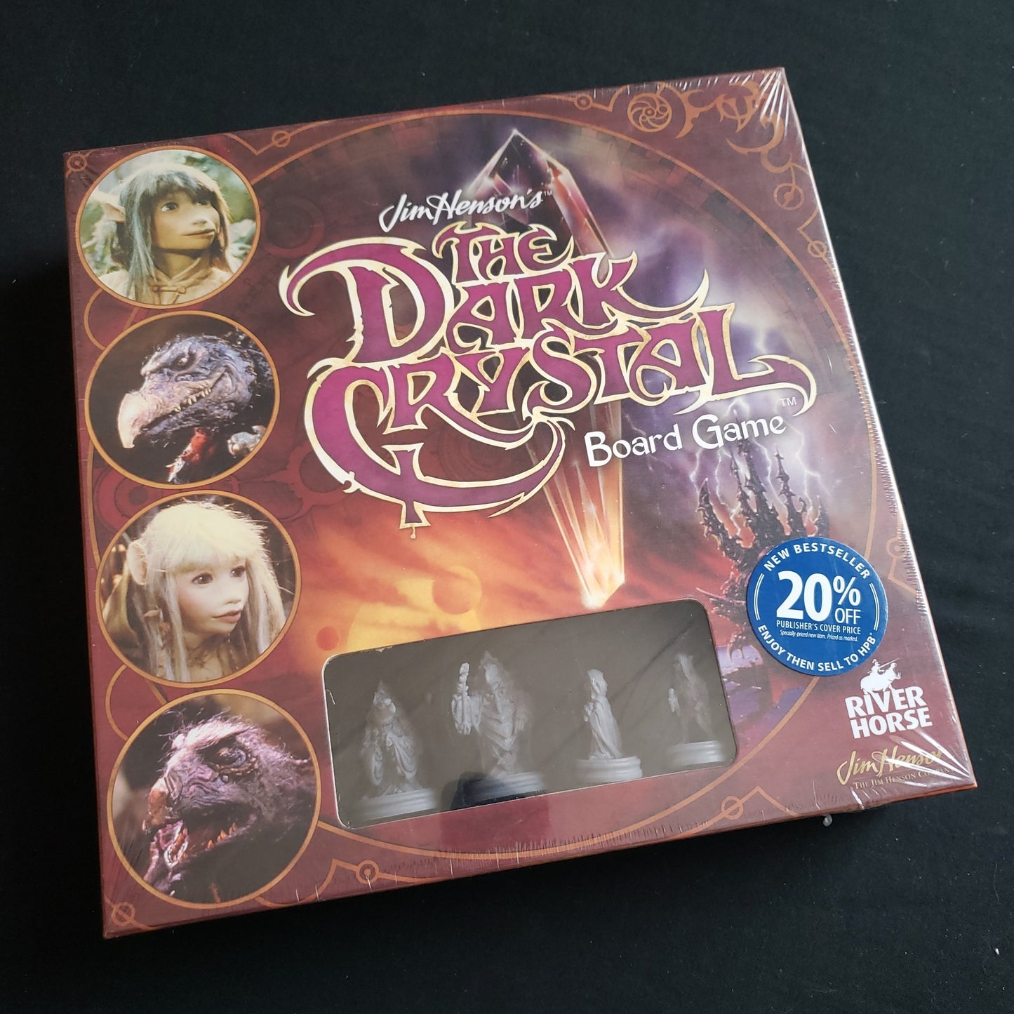 Image shows the front cover of the box of the Dark Crystal board game