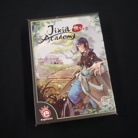 Image shows the front cover of the box of the Jixia Academy card game