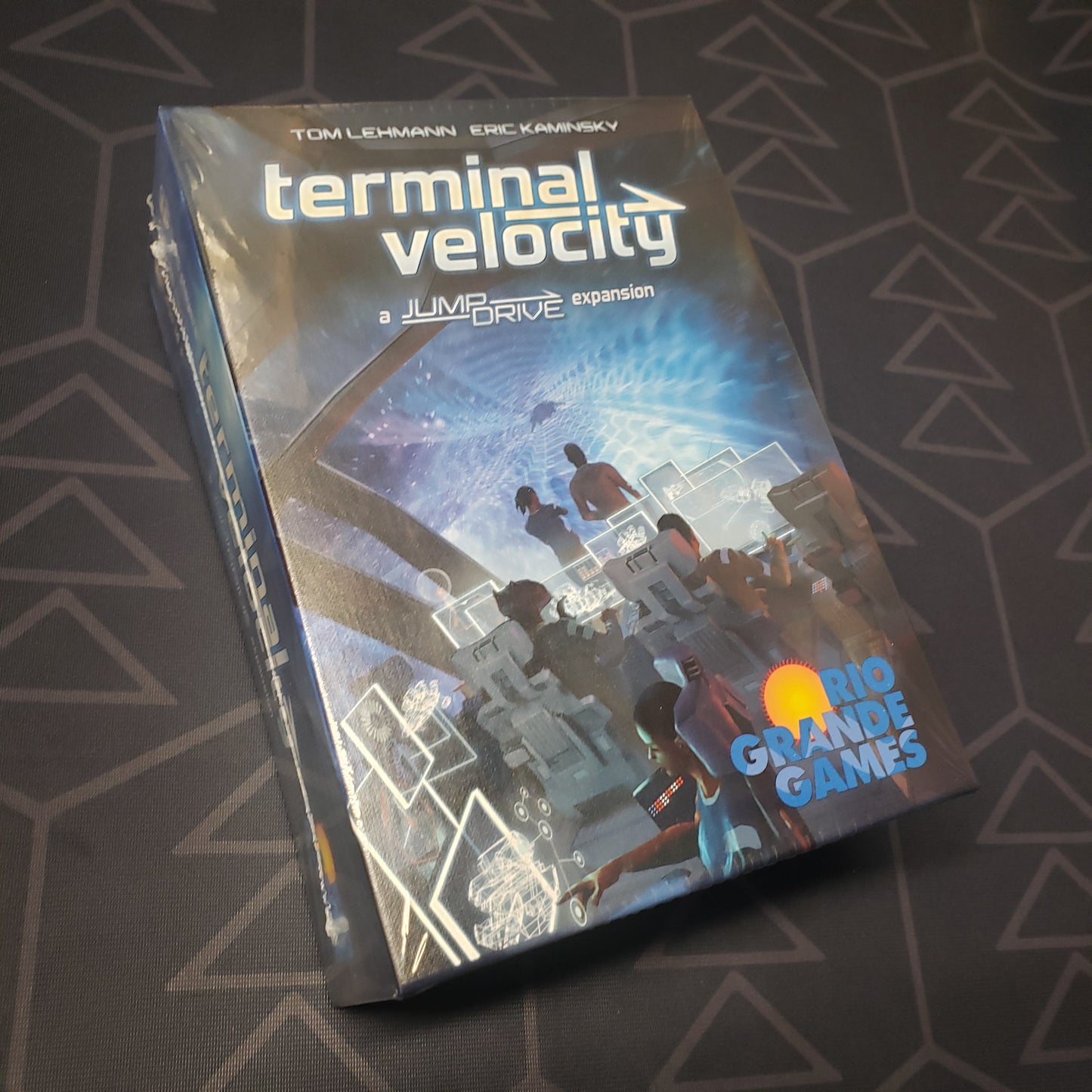 Image shows the front cover of the box of the Terminal Velocity expansion for the card game Jump Drive