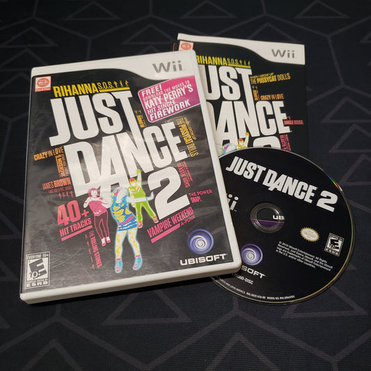 Image shows the case, manual & disc for the video game Just Dance 2 for Nintendo Wii