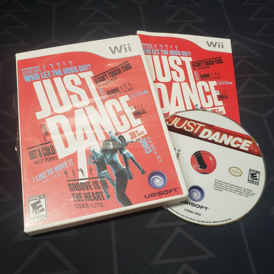 Image shows the case, manual and disc for the video game Just Dance for Nintendo Wii