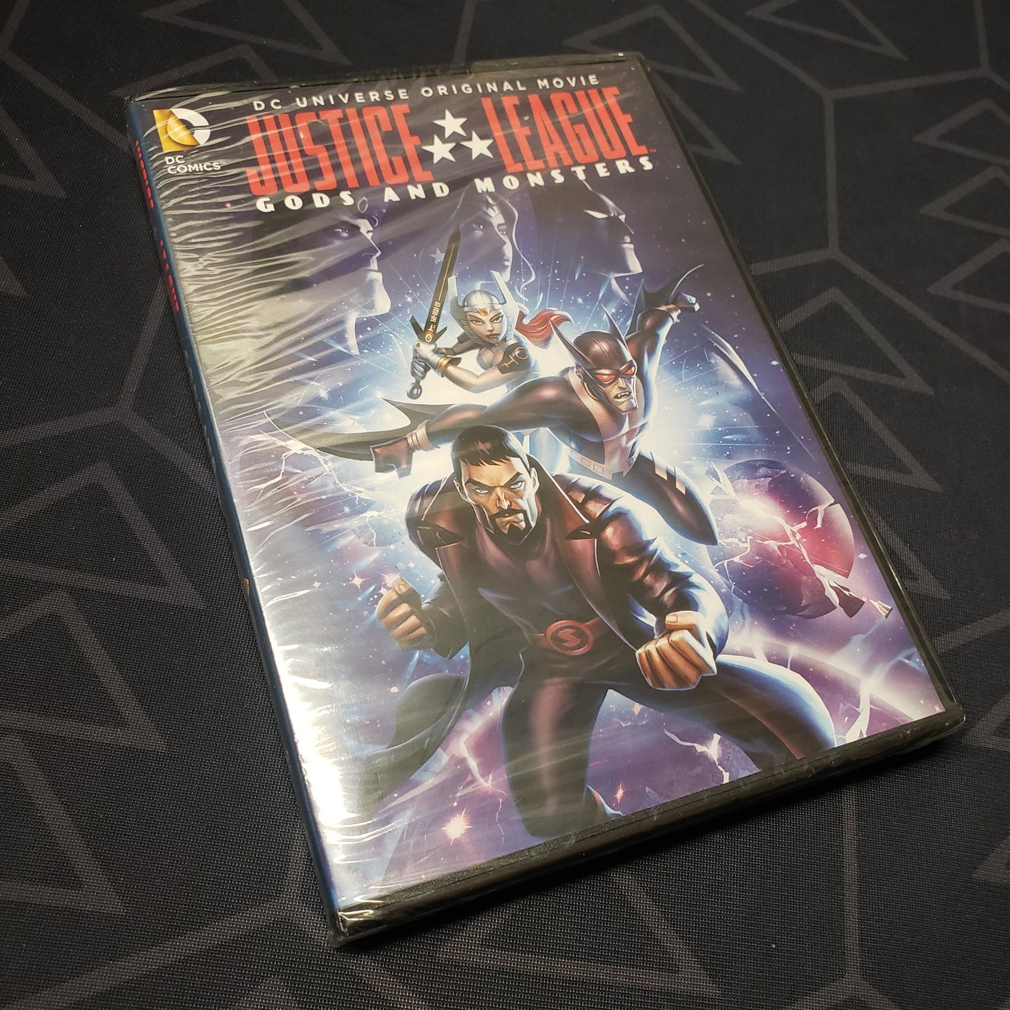 Image shows the front of the case for the movie Justice League: Gods and Monsters on DVD