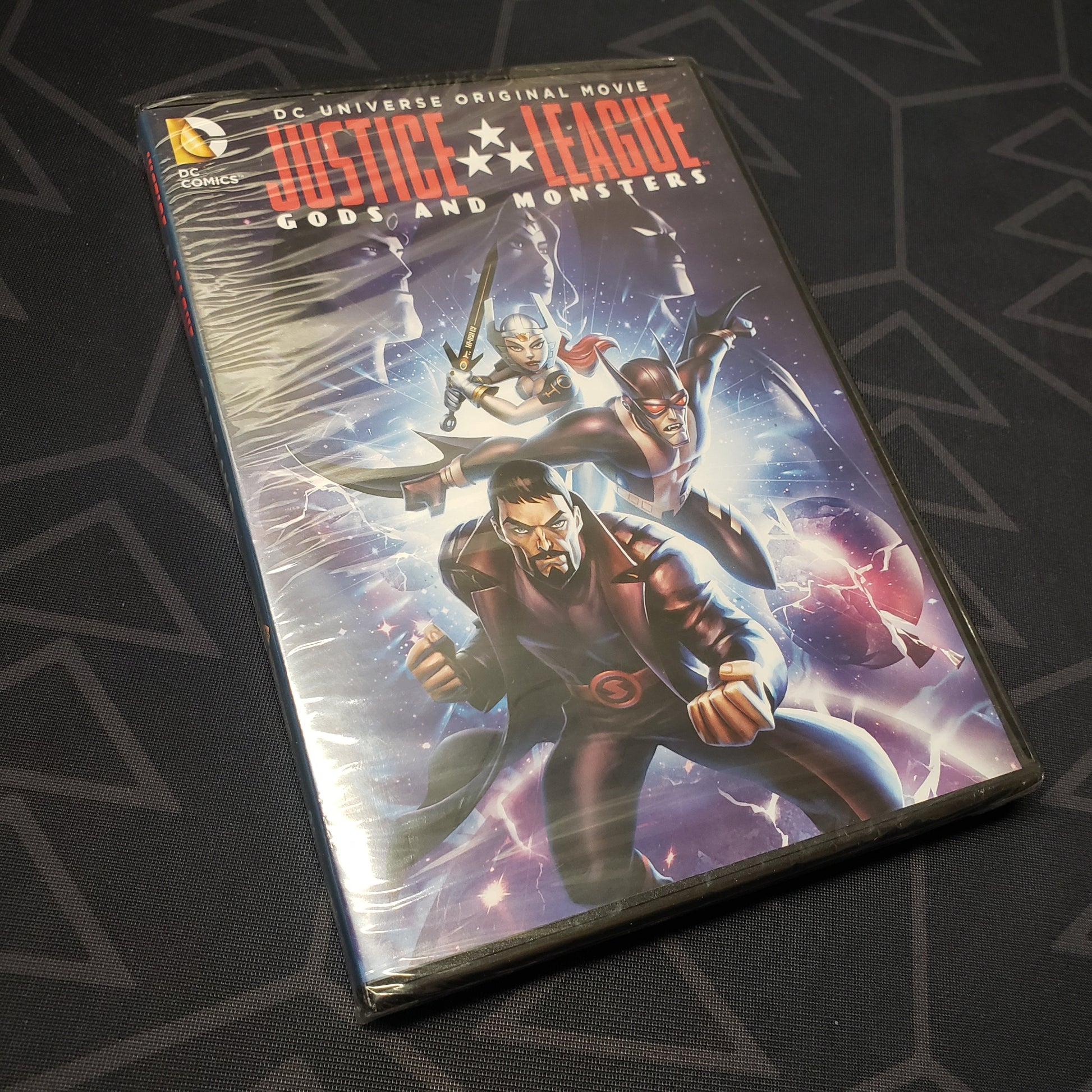 Image shows the front of the case for the movie Justice League: Gods and Monsters on DVD