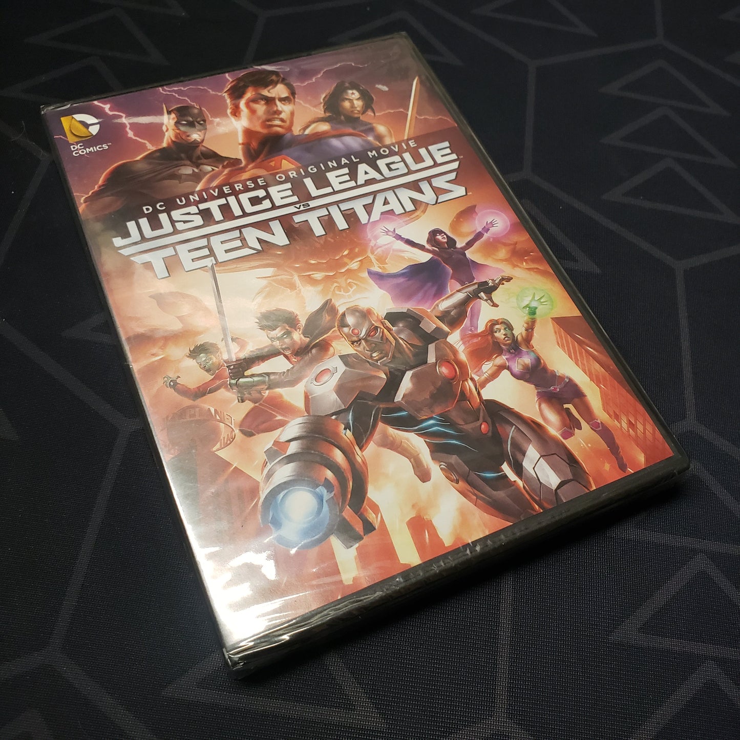 Image shows the front of the case for the movie Justice League vs. Teen Titans on DVD