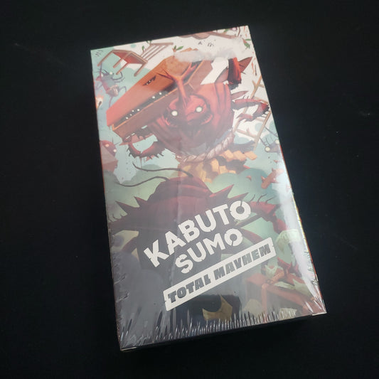Image shows the front cover of the box of the Total Mayhem expansion for the board game Kabuto Sumo
