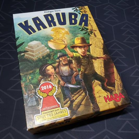 Image shows the front cover of the box of the Karuba board game