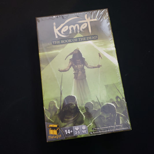 Image shows the front cover of the box of the Book of the Dead expansion for the board game Kemet: Blood & Sand