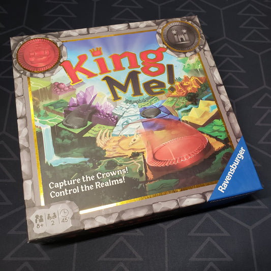 Image shows the front cover of the box for the King Me! board game