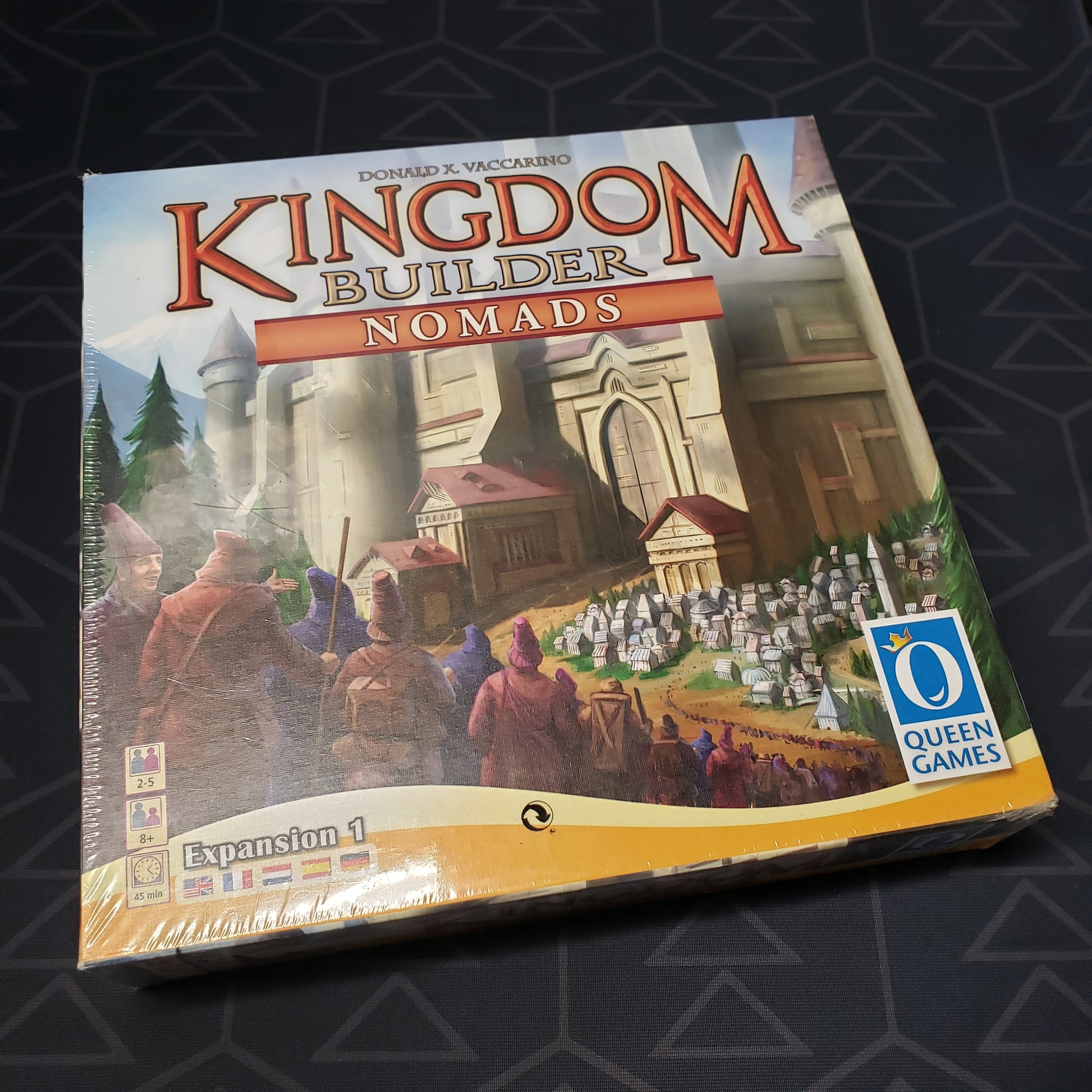 Image shows the front cover of the box of the Nomads expansion for the board game Kingdom Builder