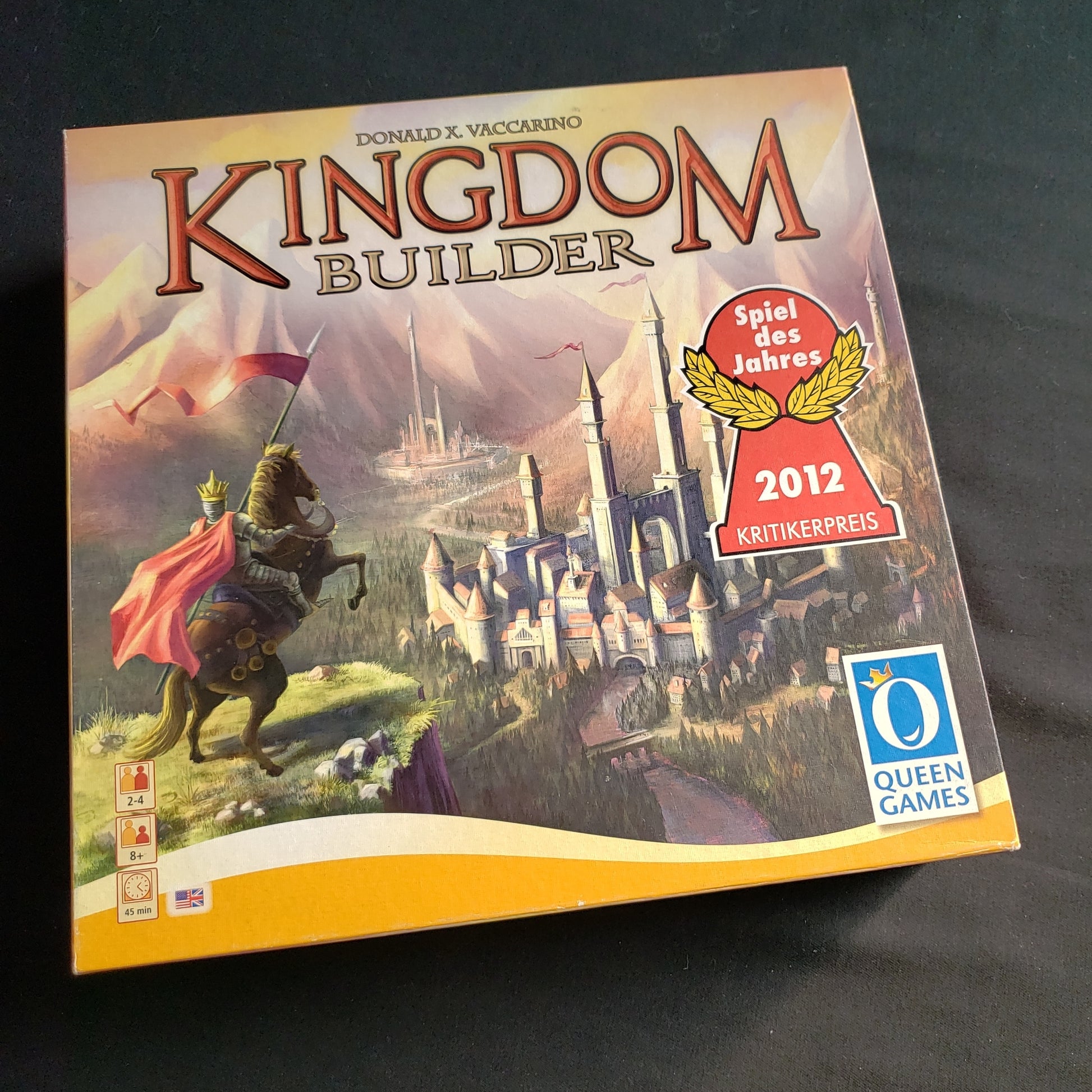 Image shows the front cover of the box of the Kingdom Builder board game