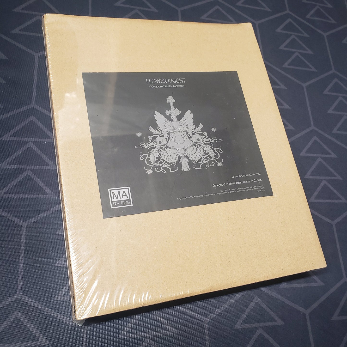 Image shows the front cover of the box of the Flower Knight expansion for the board game Kingdom Death Monster