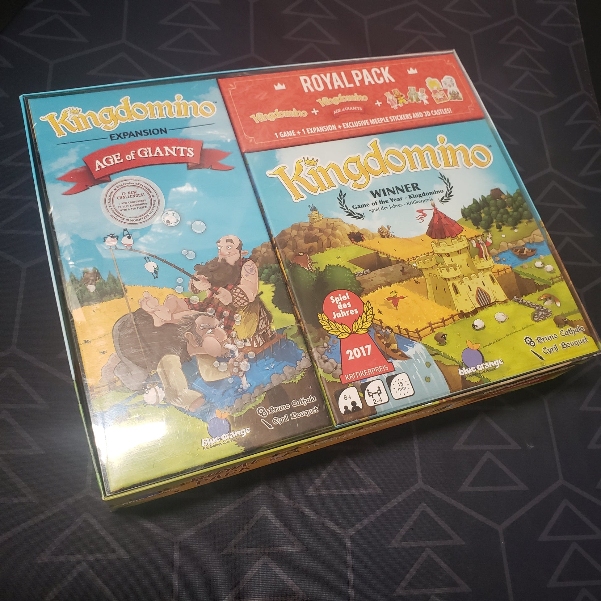 Image shows the front cover of the box for the Royal Pack edtion of the board game Kingdomino