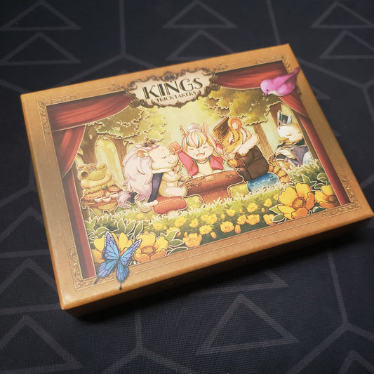 Image shows the front cover of the box for the KINGs: TRICKTAKERs (Compact Edition) card game