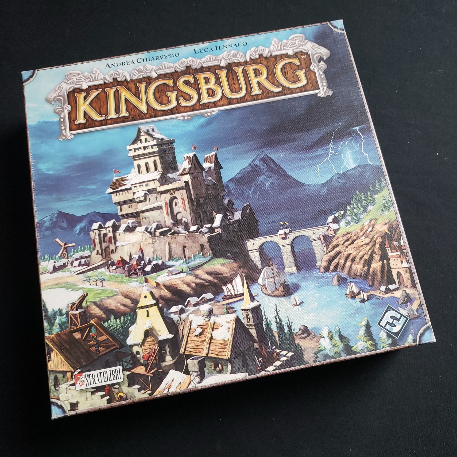 Image shows the front cover of the box of the Kingsburg board game