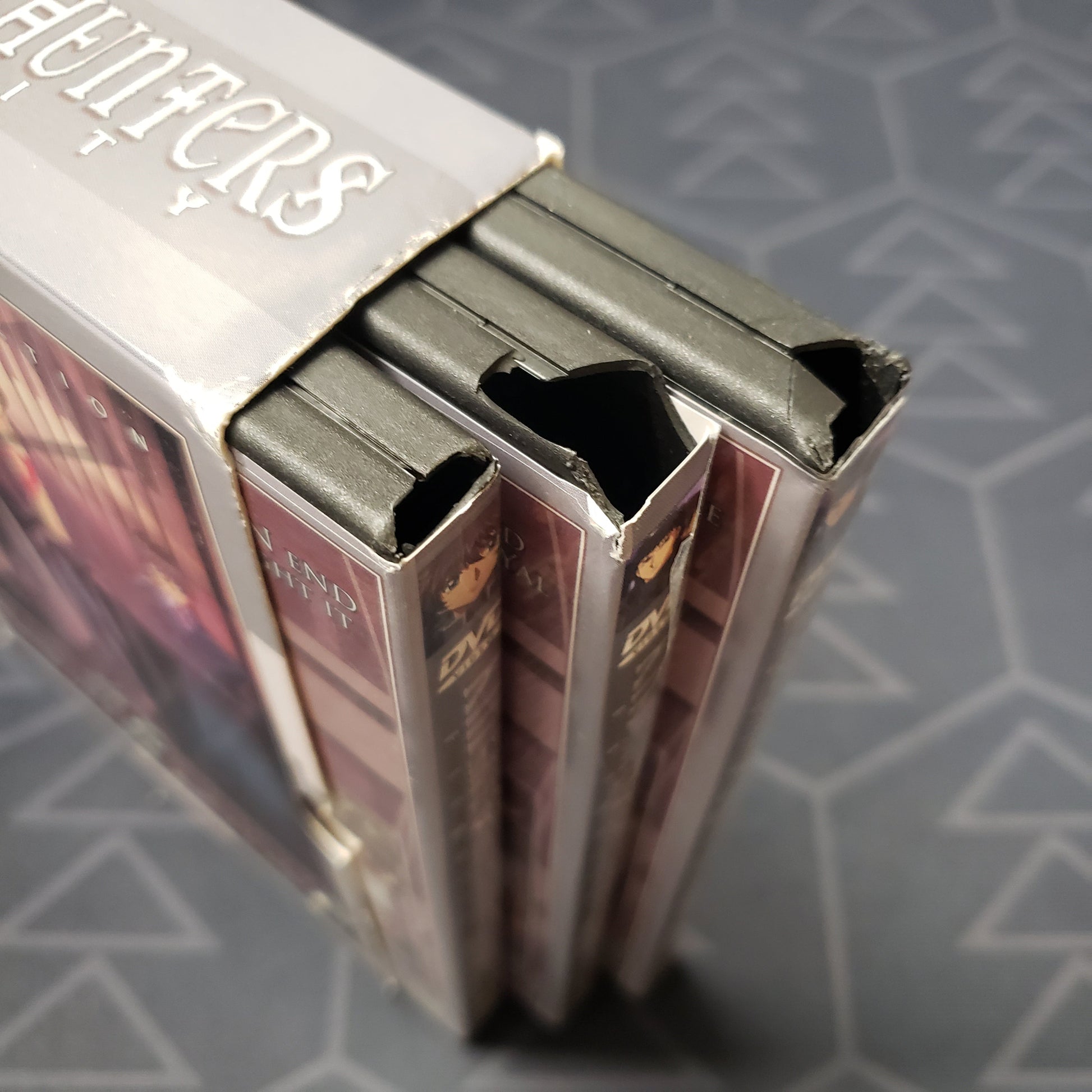 Image shows some damage to the corners of the cases for the complete series set of Knight Hunters Eternity on DVD