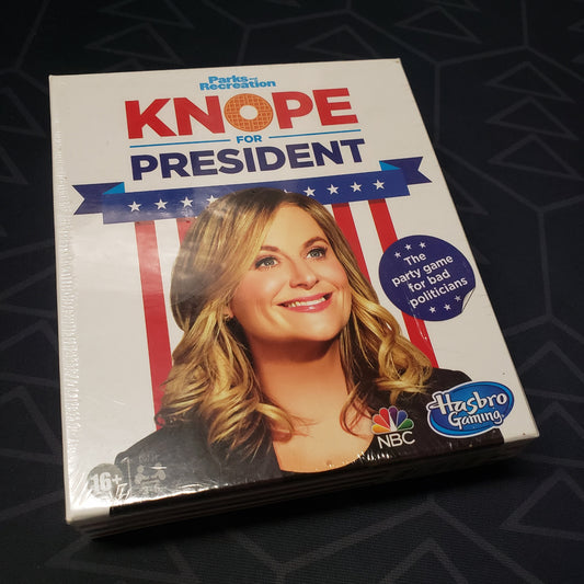 Image shows the front cover of the box of the Knope for President card game
