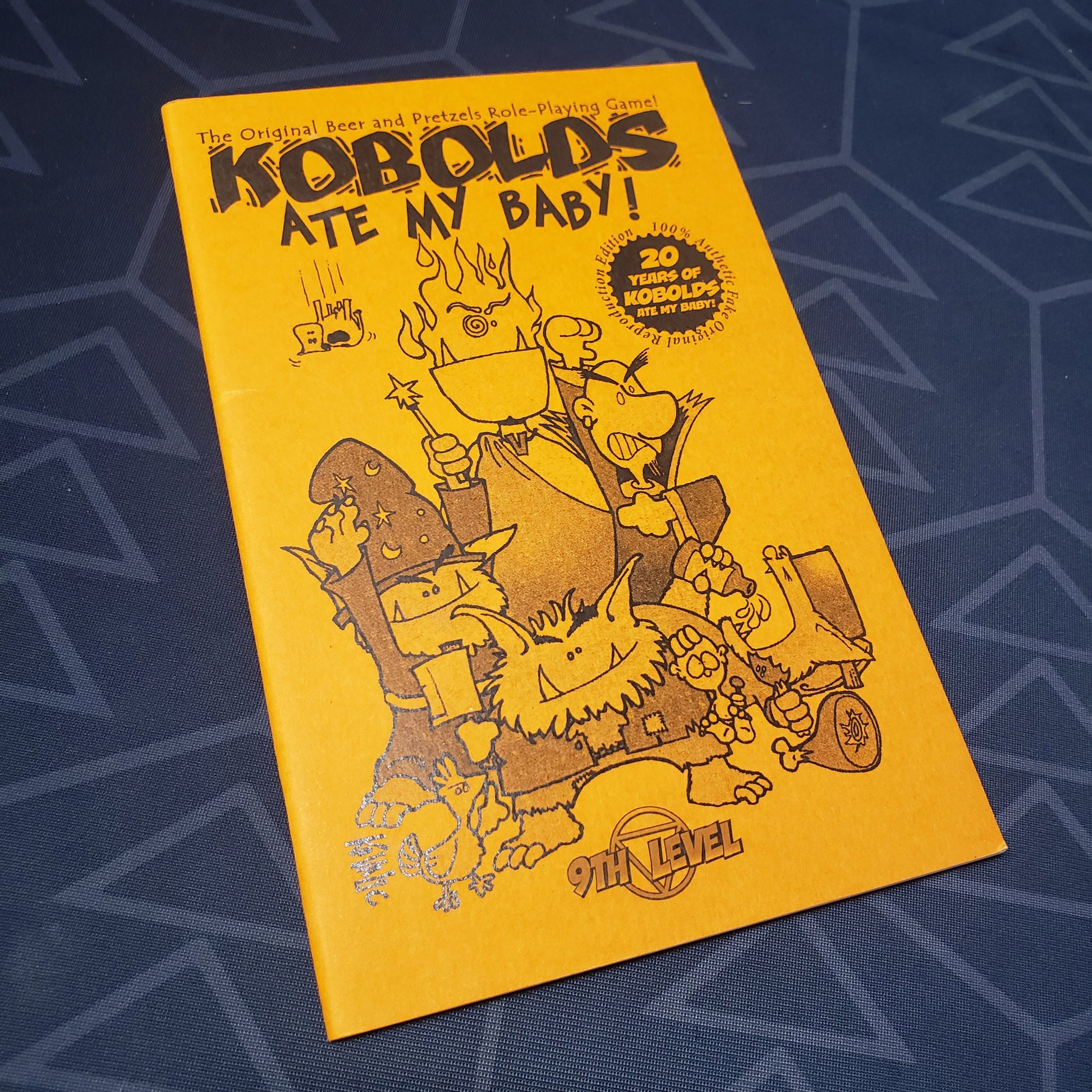 Image shows the front cover of the Kobolds Ate My Baby! (Third Edition, 20th Anniversary Reprint) roleplaying game zine