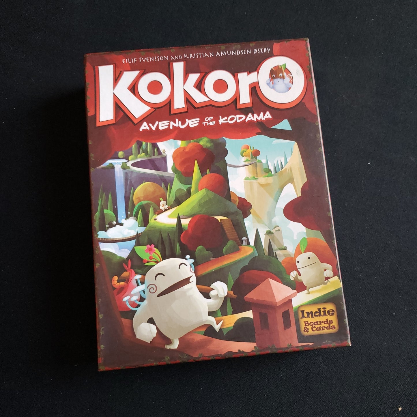 Image shows the front cover of the box of the Kokoro: Avenue of the Kodama board game