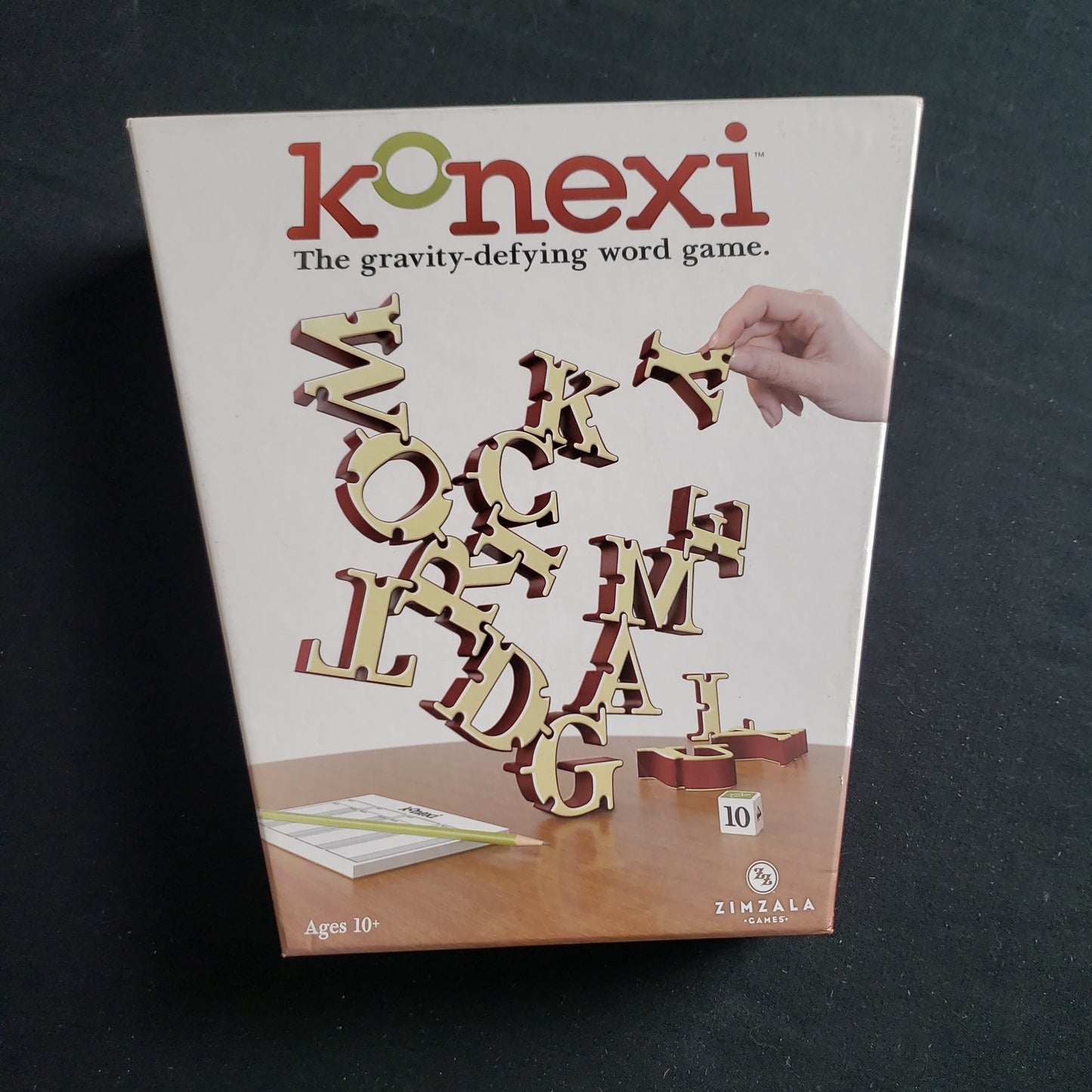 Image shows the front cover of the box of the Konexi board game