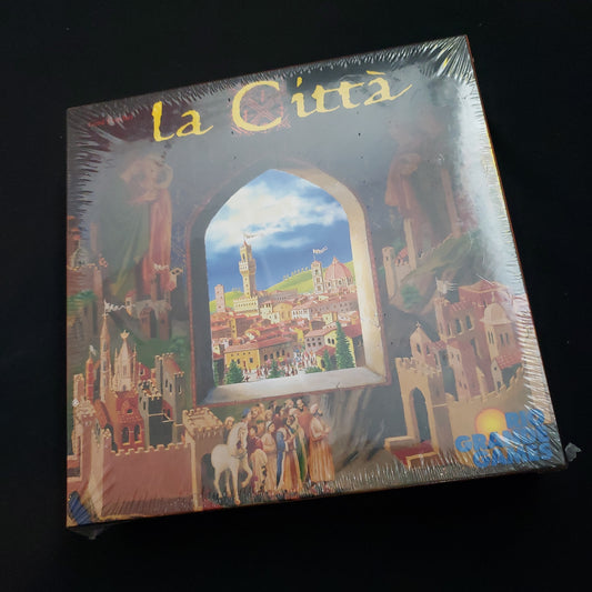 Image shows the front cover of the box of the La Citta board game