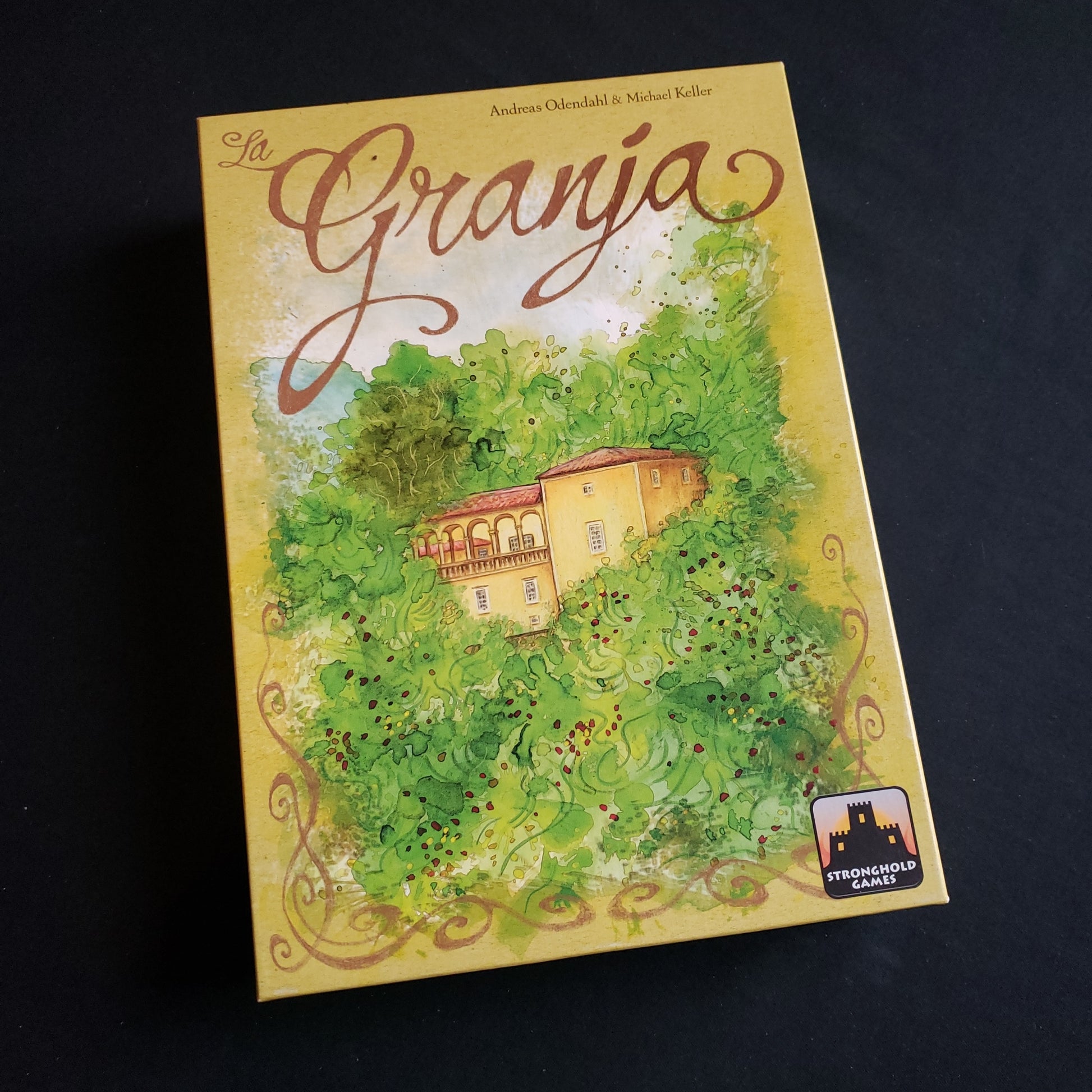 Image shows the front cover of the box of the La Granja board game