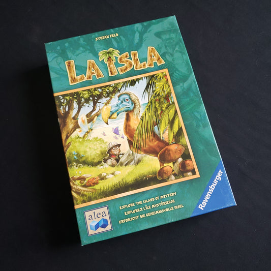 Image shows the front cover of the box of the La Isla board game