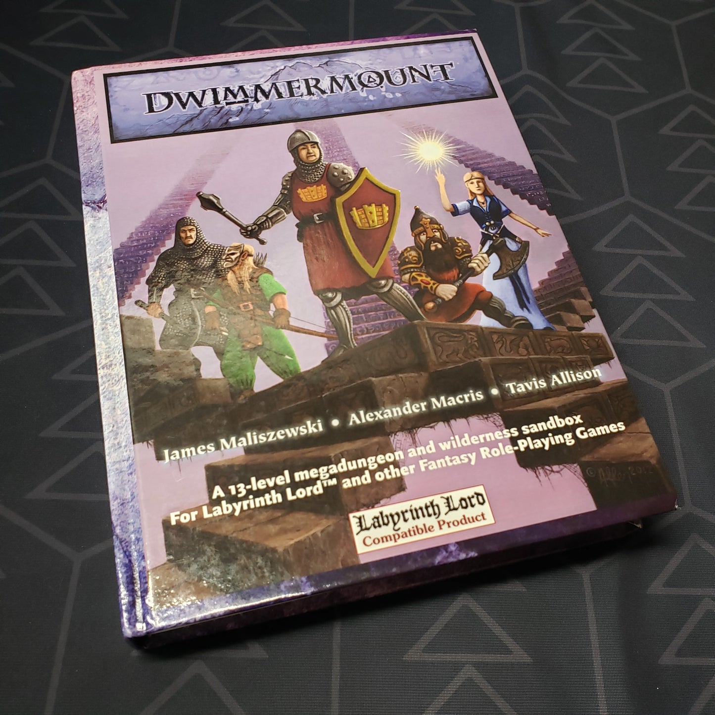 Image shows the front cover of the Dwimmermount book for the roleplaying game Labyrinth Lord