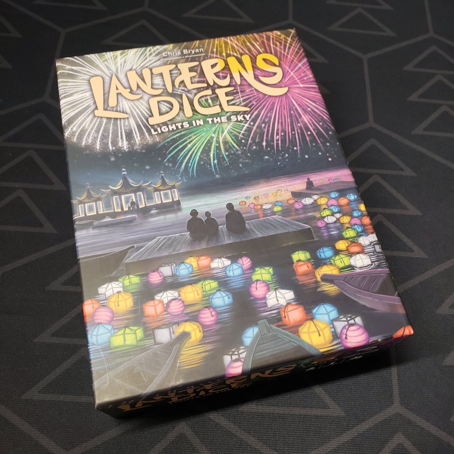 Image shows the front cover of the box of the Lanterns Dice: Lights in the Sky board game
