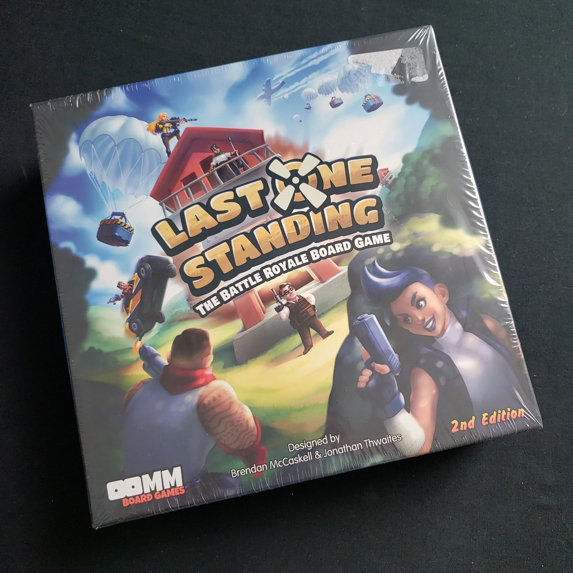 Image shows the front cover of the box of the Last One Standing board game