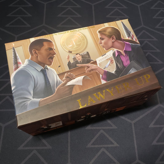 Image shows the front cover of the box for the Lawyer Up card game