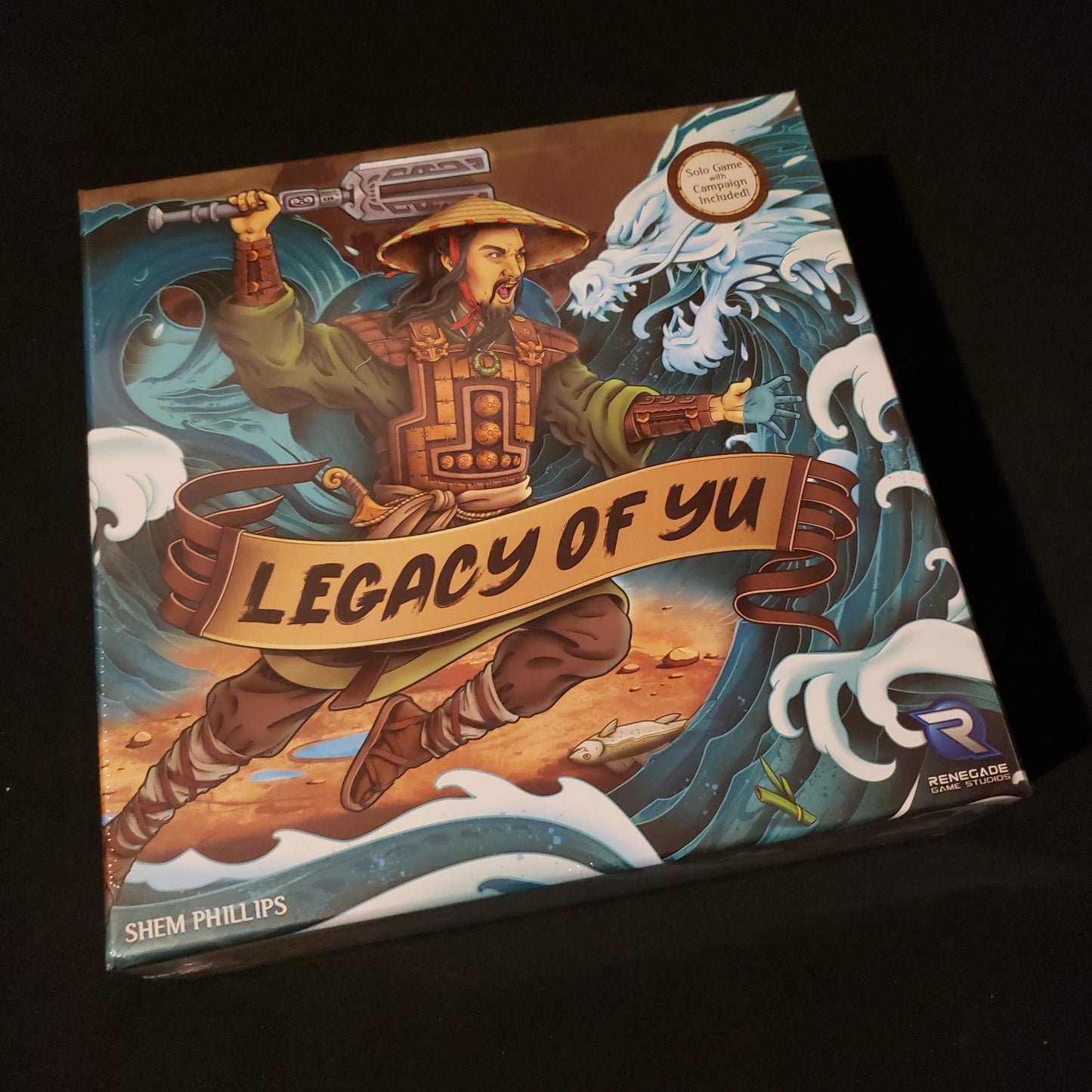 Image shows the front cover of the box of the Legacy of Yu board game
