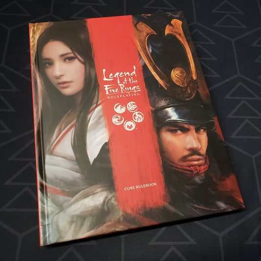 Image shows the front cover of the core rulebook for the roleplaying game Legend of the Five Rings: Fifth Edition