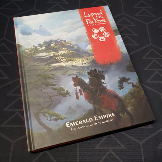 Image shows the front cover of the Emerald Empire book for the roleplaying game Legend of the Five Rings: Fifth Edition