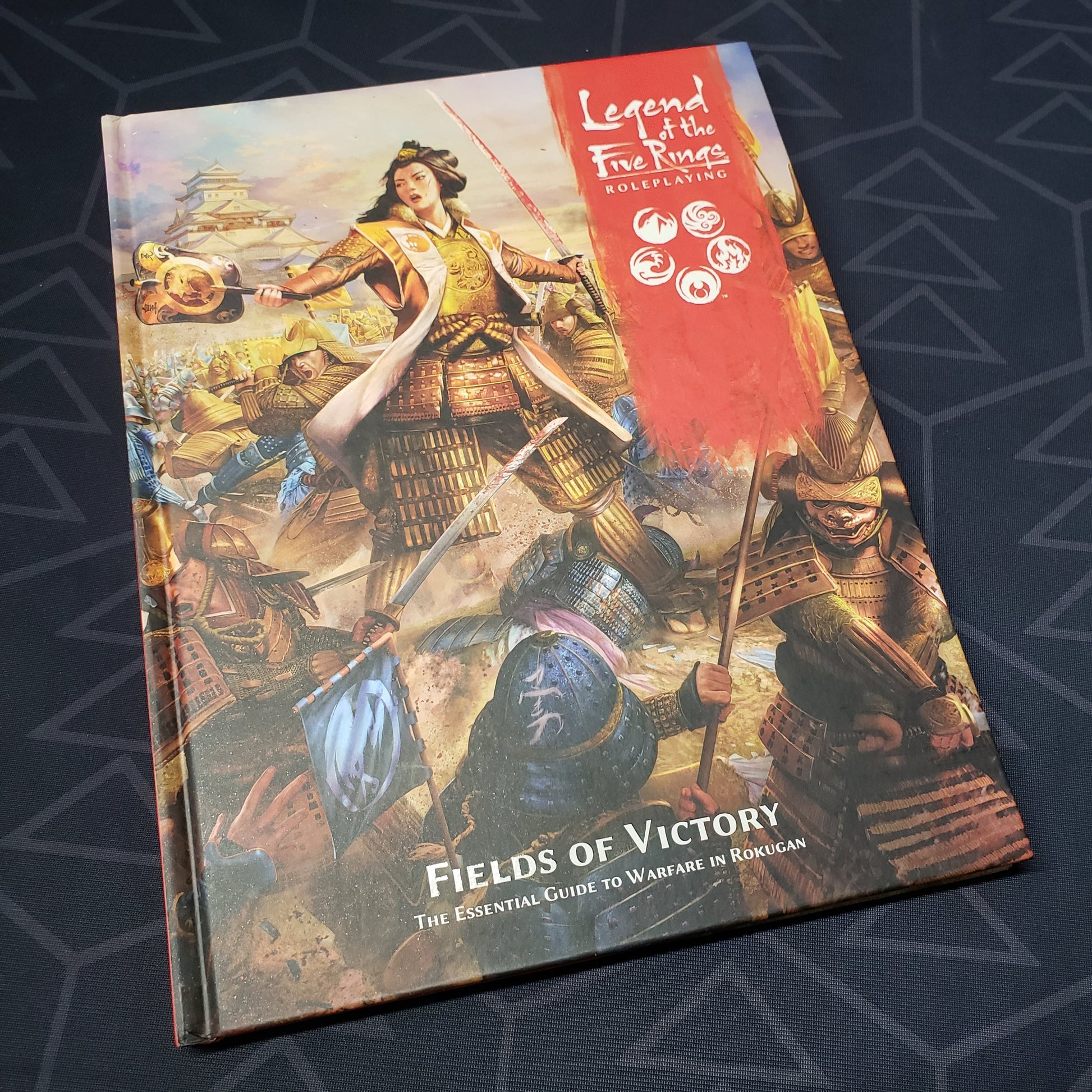 Image shows the front cover of the Fields of Victory book for the roleplaying game Legend of the Five Rings: Fifth Edition
