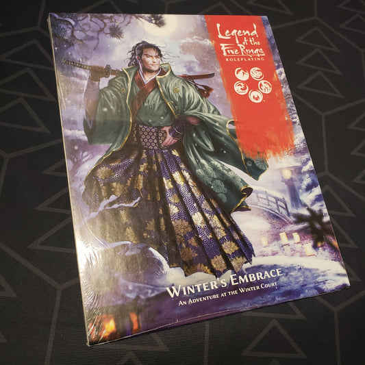 Image shows the front cover of the Winter's Embrace book for the roleplaying game Legend of the Five Rings: Fifth Edition