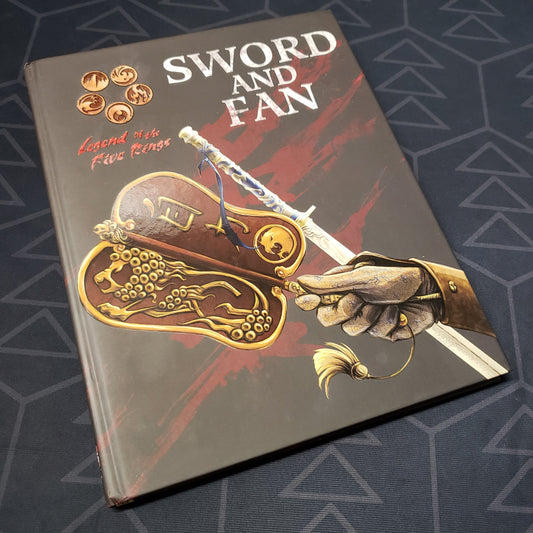 Image shows the front cover of the Sword and Fan book for the roleplaying game Legend of the Five Rings: Fourth Edition