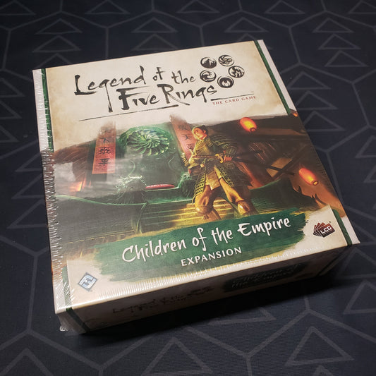 Image shows the front of the package of the Children of the Empire pack for the card game Legend of the Five Rings