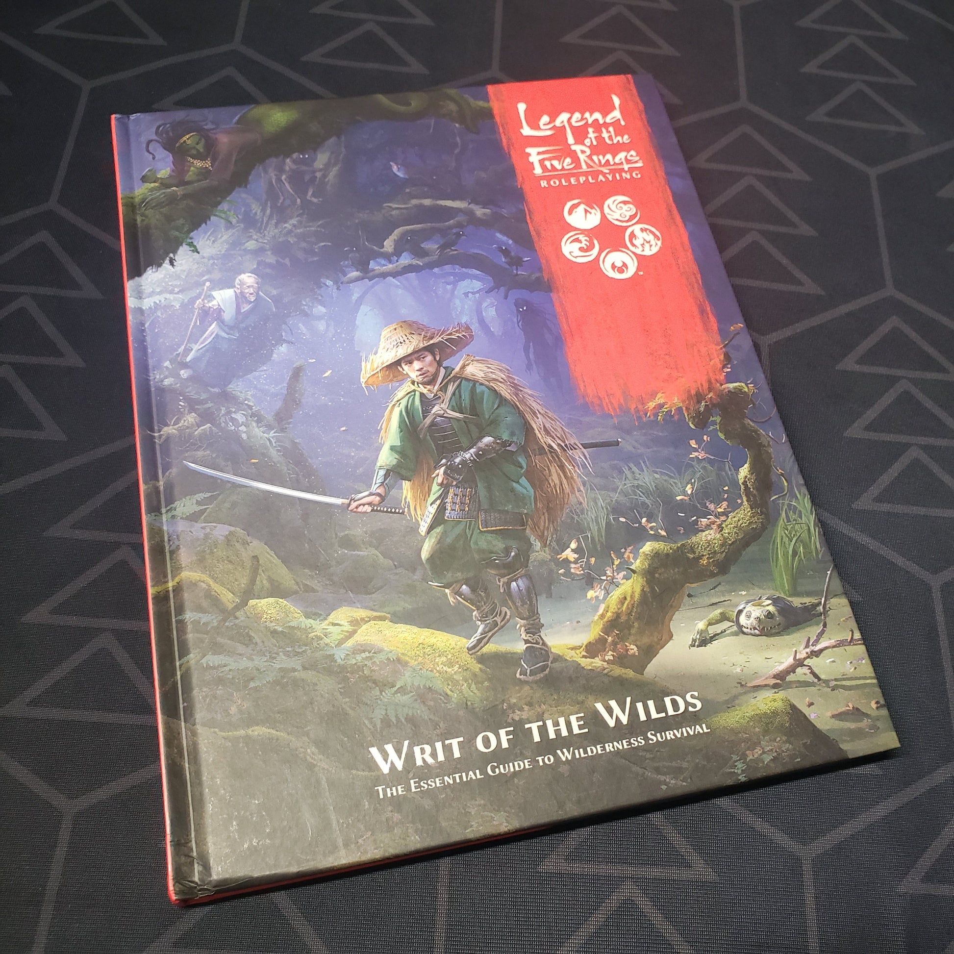Image shows the front cover of the Writ of the Wilds book for the roleplaying game Legend of the Five Rings