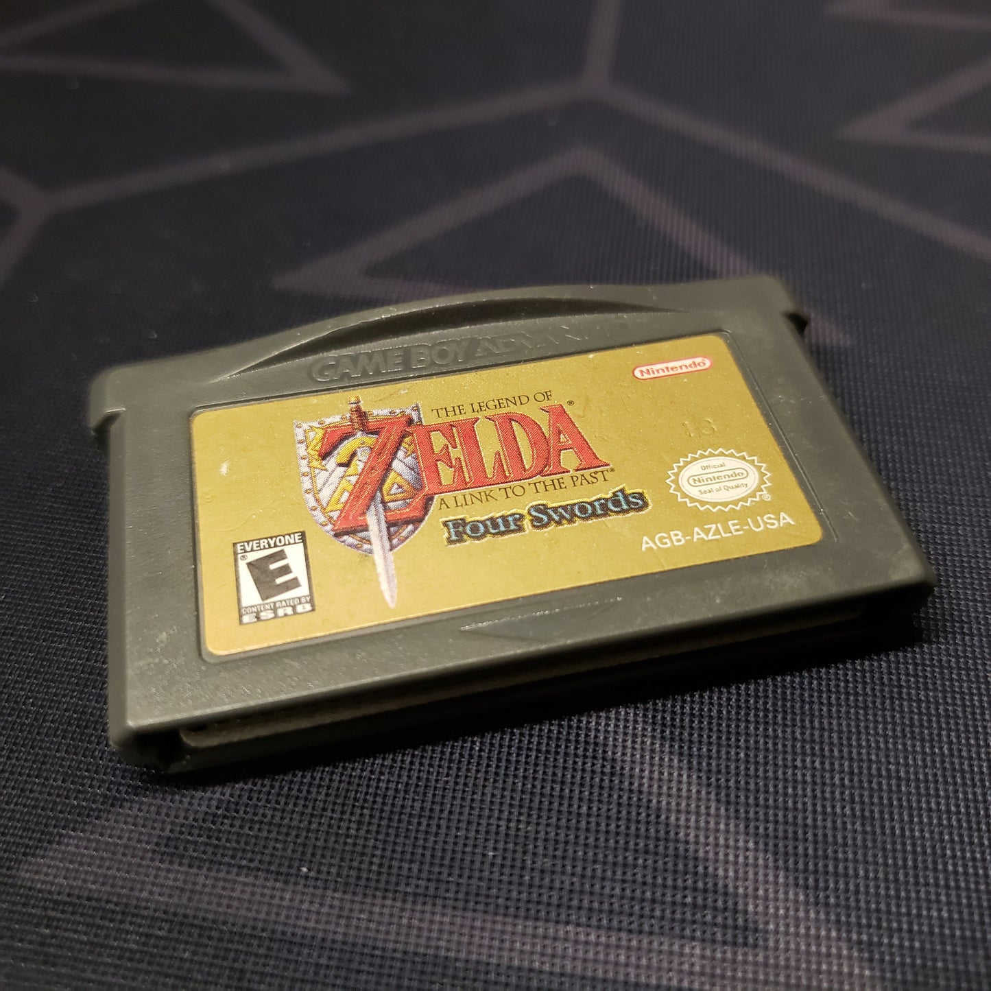 Image shows the front of the cartridge for the video game Legend of Zelda: A Link to the Past + Four Swords for Nintendo Game Boy Advance