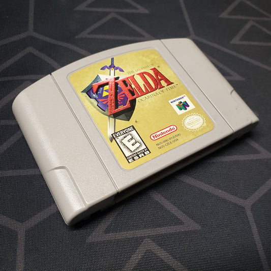 Image shows the front of the cartridge for the video game Legend of Zelda: Ocarina of Time for the Nintendo 64