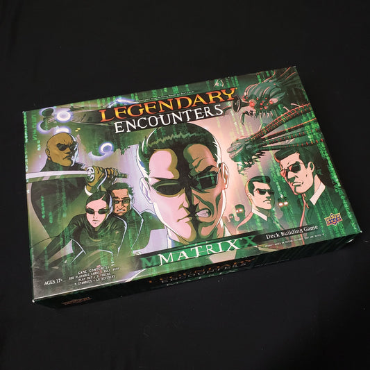 Image shows the front cover of the box of the card game Legendary Encounters: The Matrix