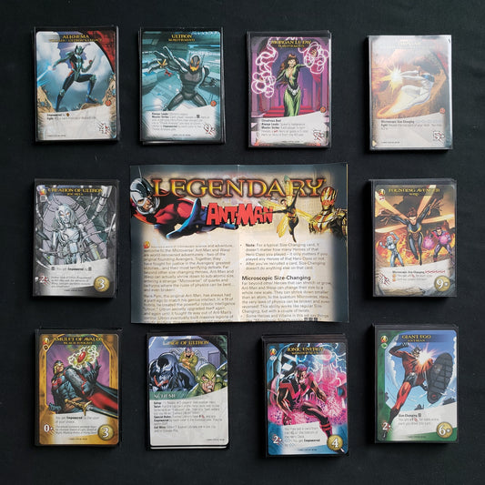 Image shows the instructions & cards arranged in stacks by card type for the Ant-Man expansion for the board game Legendary Marvel