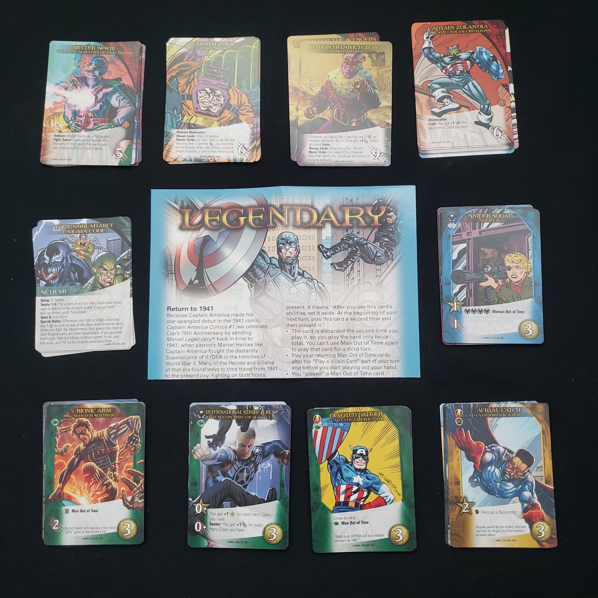 Image shows the instructions & cards arranged in stacks by card type for the Captain America 75th Anniversary expansion for the board game Legendary Marvel
