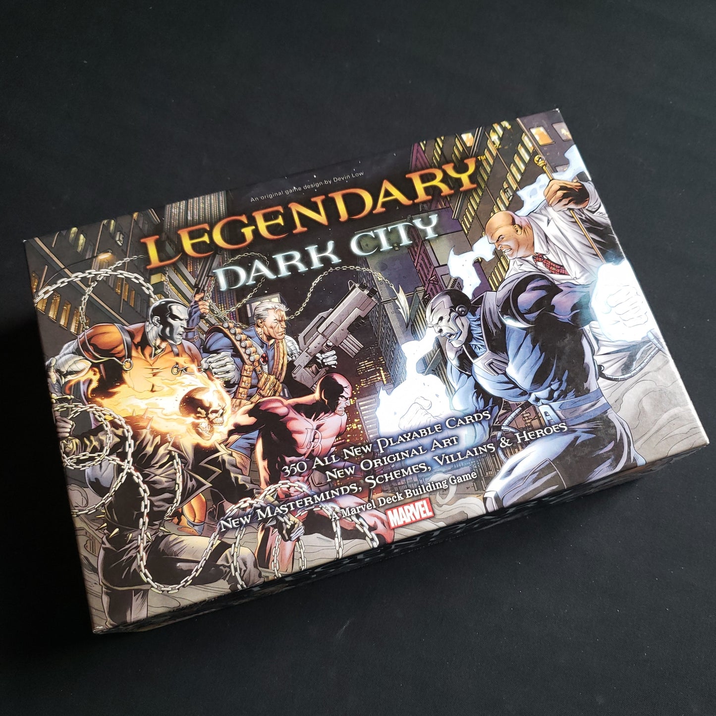 Image shows the front of the box for the Dark City Expansion for the Legendary Marvel card game