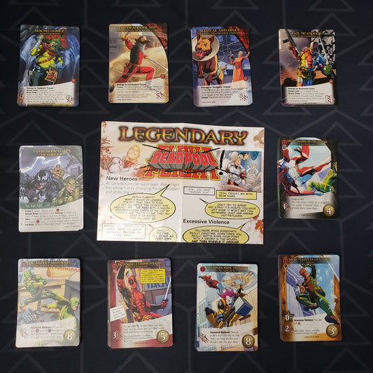 Image shows the instructions & cards arranged in stacks by card type for the Deadpool expansion for the board game Legendary Marvel