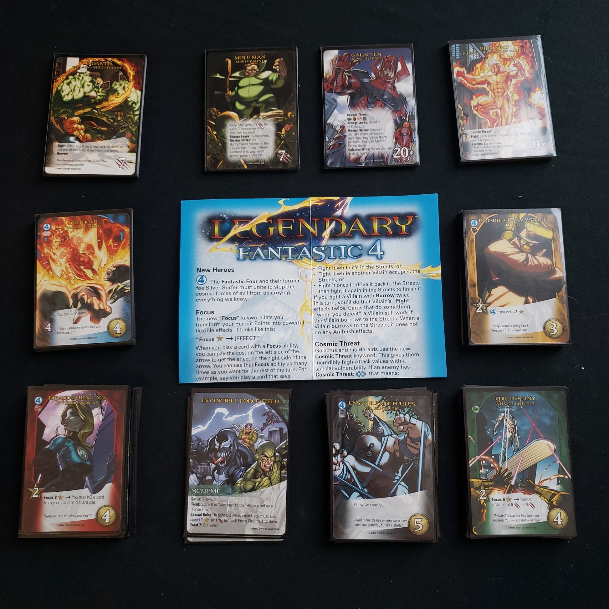 Image shows the instructions and cards for the Fantastic Four expansion for the card game Legendary Marvel