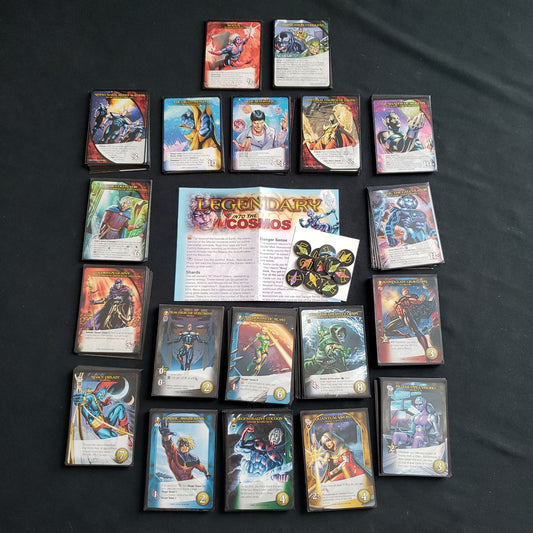 Image shows the instructions & cards arranged in stacks by card type for the Into the Cosmos expansion for the board game Legendary Marvel