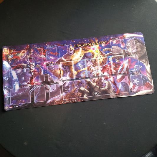Image shows a rolled out playmat for the Legendary Marvel board game featuring Thanos Vs The Avengers art