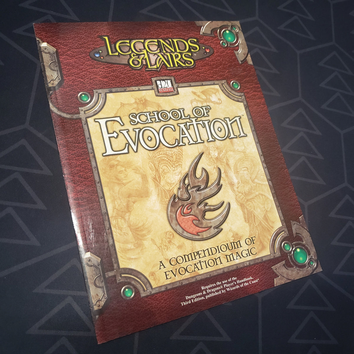 Image shows the front cover of the Legends & Lairs: School of Evocation roleplaying game book
